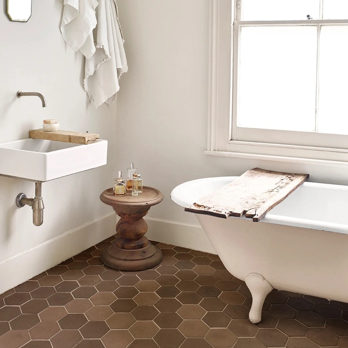 Brown terracotta tiles on bathroom floor